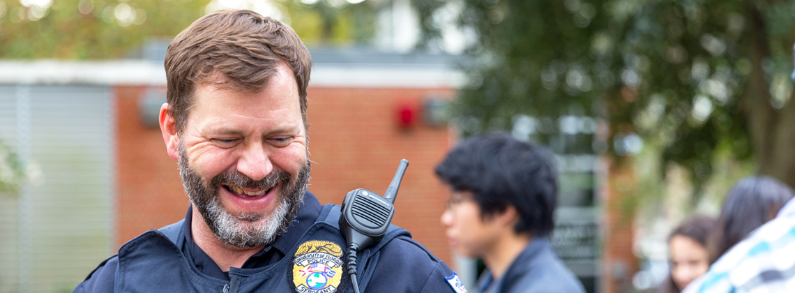 Police officer smiling.